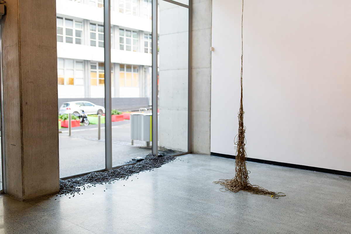 Hanging harakeke rope, stones along floor